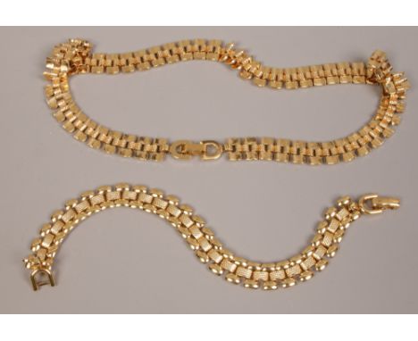 A vintage Monet gold plated necklace and bracelet en suite. 