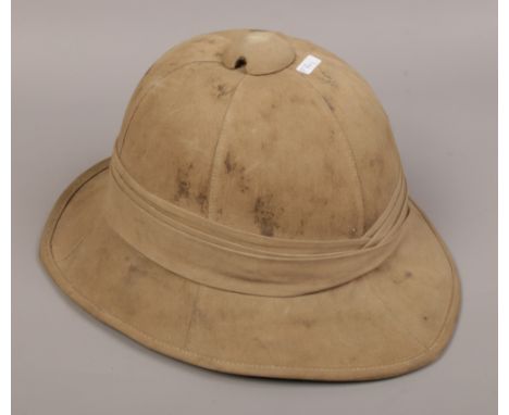 A 1942 World War II British Army Foreign Service khaki pith helmet size 6 7/8 by Pailsworth Hats Ltd. 