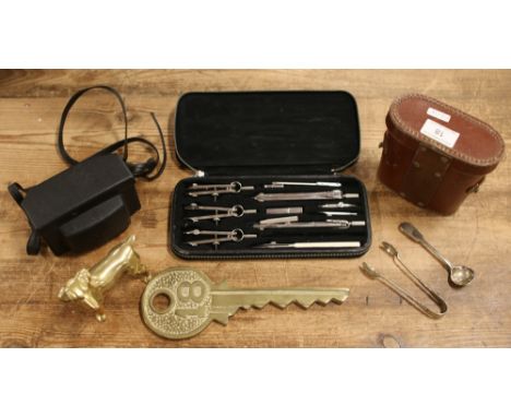 A group lot of collectables to include cased binoculars, brass dog, vintage drawer equipment, silver spoon etc. 