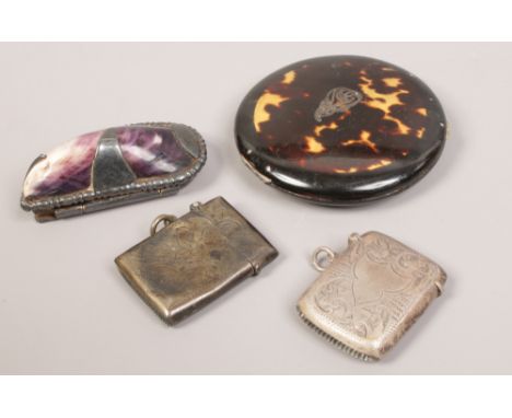 Two silver vesta cases, a tortoise shell powder compact and a mussel shell snuff box. 