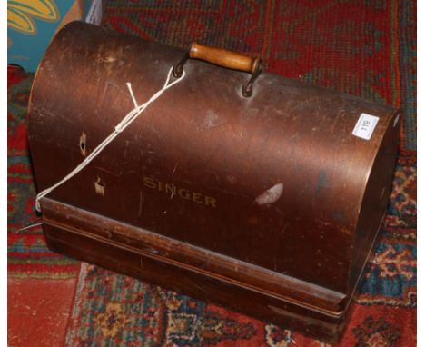 A vintage dome cased Singer sewing machine converted to electric, no key. 