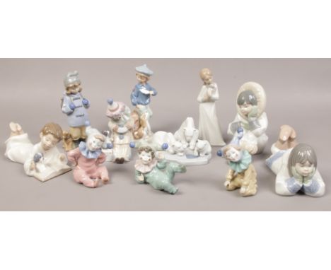 A quantity of Nao figurines to include set of clowns, Lladro polar bear figure group, boy and dog etc. 