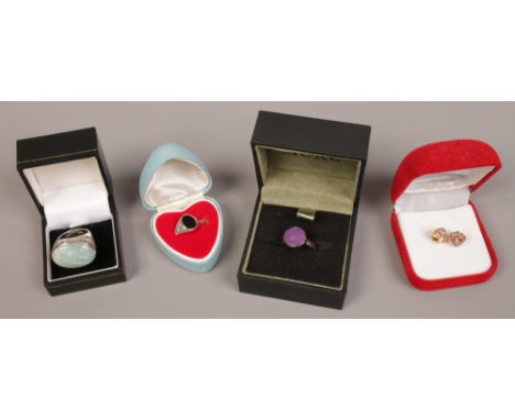 Three cased silver gem set rings, along with a cased pair of yellow metal ruby and pearl earrings. 