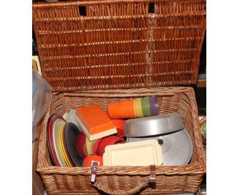 A vintage wicker picnic hamper and contents. 