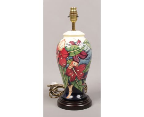 A Moorcroft baluster shaped table lamp base decorated with tiger lillies. 