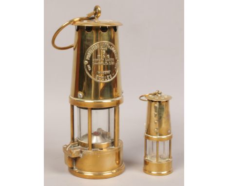 A Eccles type 6 miners lamp, along with a small decorative brass lamp. 
