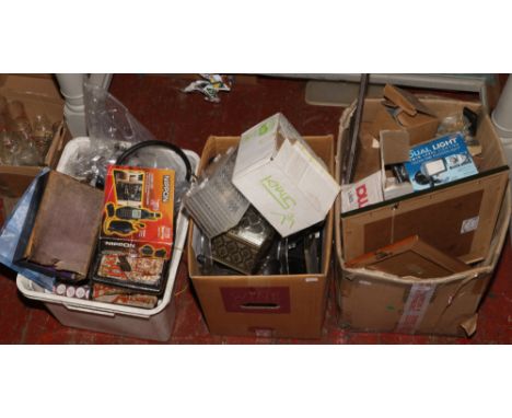 Three boxes of miscellaneous including spare pendulum clock parts, 150 watt floodlight, sigma alarm immobiliser etc. 