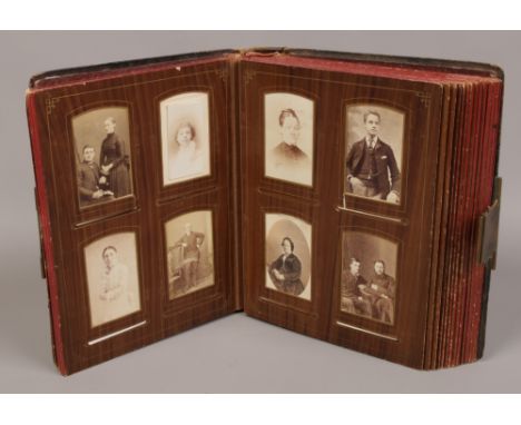 A Victorian photograph album with contents of portrait photographs. 
