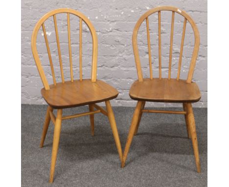 A pair of Ercol style spindle back dining chairs. 
