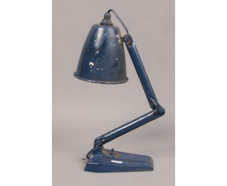 An industrial anglepoise work lamp with cast iron base. 
