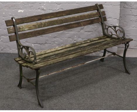 A cast iron and pine garden bench. 