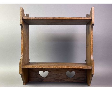 ARTS &amp; CRAFTS OAK HANGING SHELF LATE 19TH CENTURY with two shelves on shaped uprights, lower pierced heart motifs40.8cm h
