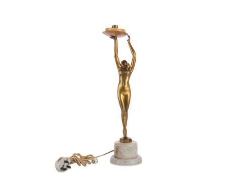 ART DECO GILT SPELTER FIGURAL TABLE LAMP EARLY 20TH CENTURY modelled as a nude maiden raising the light fitting, on marble so