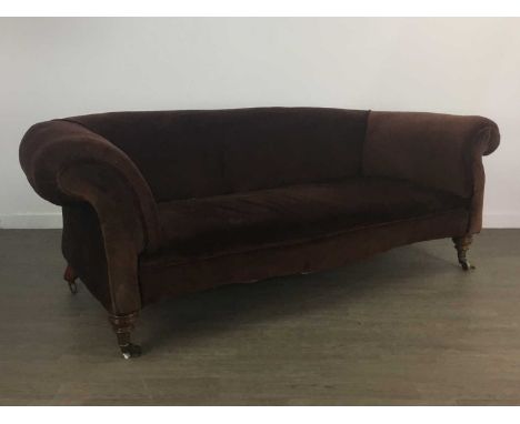 HOWARD &amp; SONS, CHESTERFIELD SETTEE LATE 19TH / EARLY 20TH CENTURY of slight serpentine outline, upholstered in brown dral