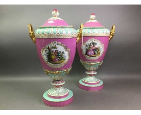 PAIR OF BERLIN PORCELAIN URN SHAPED VASES LATE 19TH CENTURY each with domed cover with bud finial, twin upright handles, pain