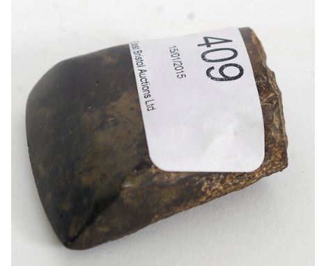 A Neolithic axe head. Measures 4.5cms high