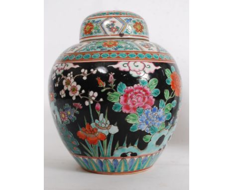 A 20th century Chinese polychrome enamel decorated ginger jar, Ironstone
