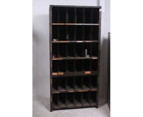 An original mid 20th century Industrial large green enamel metal 42 section cubby cabinet. Each cubby section having painted 