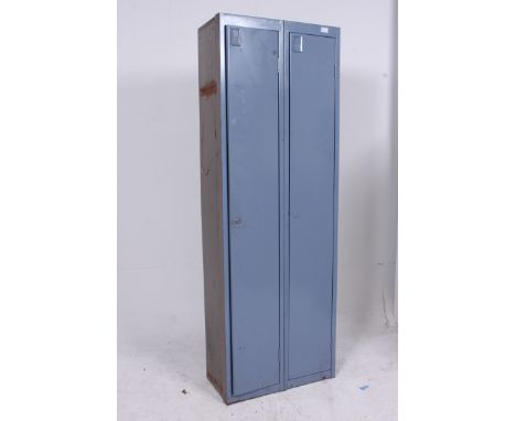 An original mid 20th century enamel blue  painted metal twin / double locker having upright bodies with full length doors and