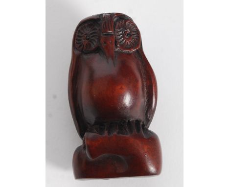 A wooden carved Netsuke of a an Owl