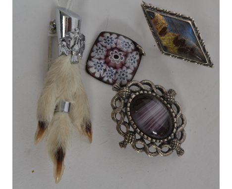 SCOTTISH; A collection of Scottish jewellery to include a white metal grouse foot thistle brooch along with two kilt sash bro