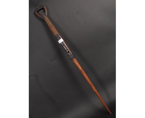 A Tanzanian sword stick / walking stick. The shaped handle lifting off to reveal dagger / knife. The tapered hardwood stem  b