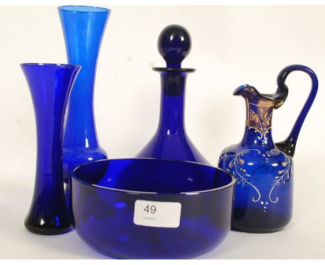 A collection of Bristol & Thomas Webb blue glass to include stem vases, bowl, decanter and hand painted glass ewer