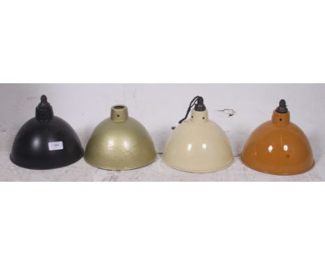 A set of 4 vintage 20th century retro enamel pendant shades of varying colours