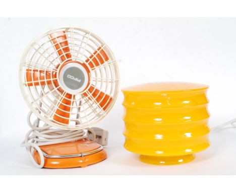 A boxed Pifco orange retro table fan along with a Habitat glass table lamp