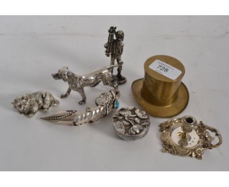 A collection of silver plated wares include miniature chamber candlestick, dog figurine, cat figurine, miner, brass hat and a