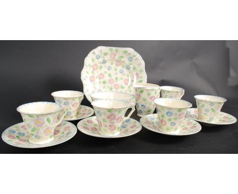 A retro early 20th century Midwinter part tea service being hand painted in a chintz foliate pattern, Comprising cups, saucer