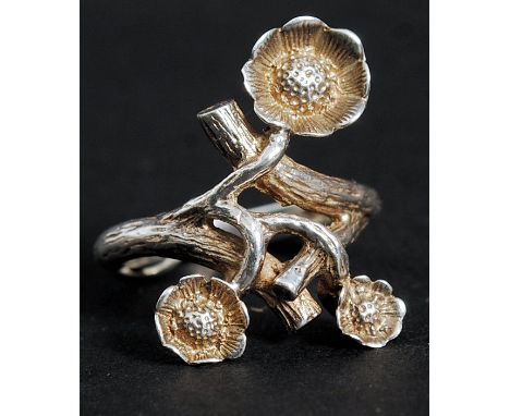 A hallmarked silver ladies ring in the form of flowers / tree branch with blossom