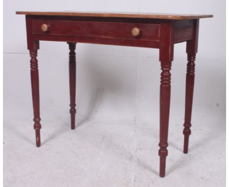 A 19th century Victorian console table having fine turned legs, full length drawers, original painted base with stripped and 