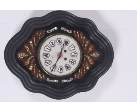 A 19th century French comtoise hanging wall clock having enamel white face with roman numeral chapter ring. The dial being pa