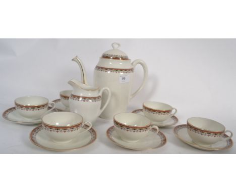 A 20th century Limoges part tea service comprising cups, saucers, creamer and teapot etc