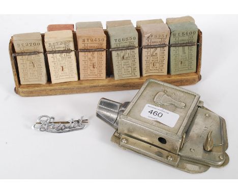 A collection of 1930's Bristol Tram Ways items, comprising of; ticket rack, ticket punch and an original Bristol Tramways uni