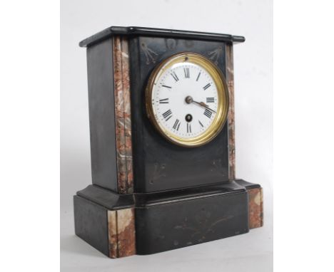 A 19th century slate and marble mantel clock. The enamel face with roman numbers, bevelled glass door with brass movement com