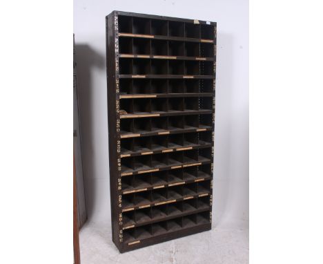 An original mid 20th century Industrial large green enamel metal 78 section cubby cabinet. Each cubby section having painted 