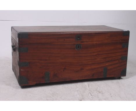 A 19th century Anglo-Chinese camphor wood campaign trunk chest. The body with inset brass handles and bracket work with hinge
