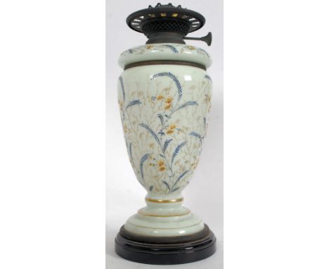 A Late 19th Century Opaque Glass Oil Lamp decorated in blue enamels with handpainted finish of flowers. Duplex Controls Inscr