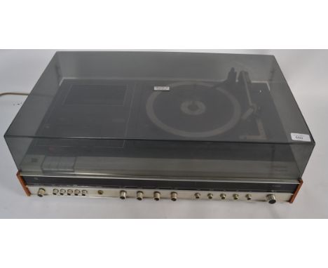 A vintage 1970's Ferguson Record player having hinged smoked acrylic top with silvered facia