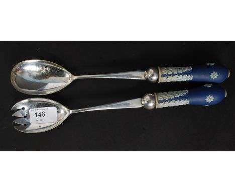 A  pair of Wedgwood Jasperware salad serviers having ceramic handles and plated stems and bowls. Measures 30cms long