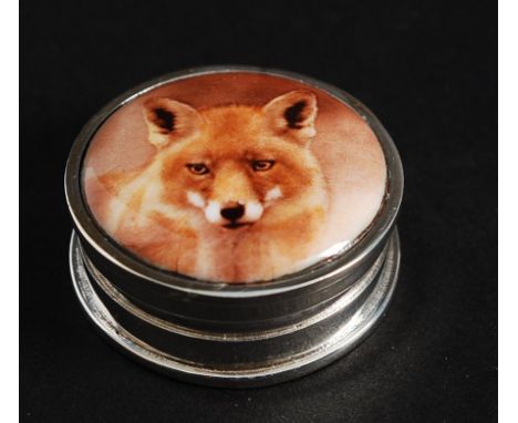 A white metal ( 925 indicating silver ) and enamel pill box depicting a fox.