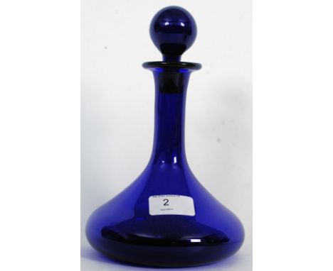 A good Thomas Webb Bristol blue glass ships shaped decanter being stamped to the base together with 2 Parian ware neo-classic