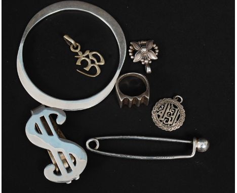 A collection of silver to include hallmarked babies oversize safety pin, bracelet , dollar note clip, ring and 3 necklace pen