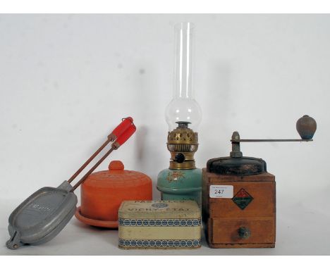 A good mixed lot of French items to include an enamel oil lamp, coffee grinder, Madeleine maker, cheese cloche and a vintage 
