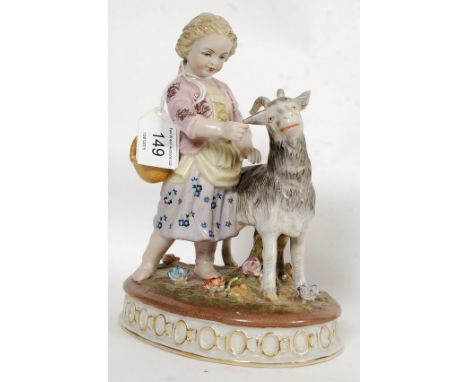 A Victorian style 20th century ceramic figure of a child and goat.