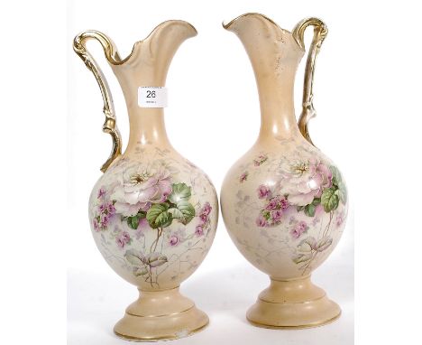 A pair of 19th century ivory blush vases / ewers in the manner of Royal Worcester. likely Austrian with gilt finish handles