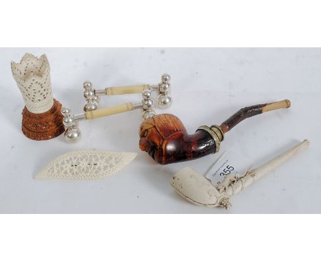 A mixed lot of items to include Meerschaum pipe, dog pipe, a pair of plated knife rests, pierced ivory brooch, carved nut, an