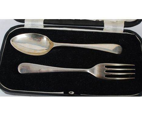 A silver hallmarked cased christening set comprising spoon and fork in black morocco case. The hallmarks for Edward Viner, Sh